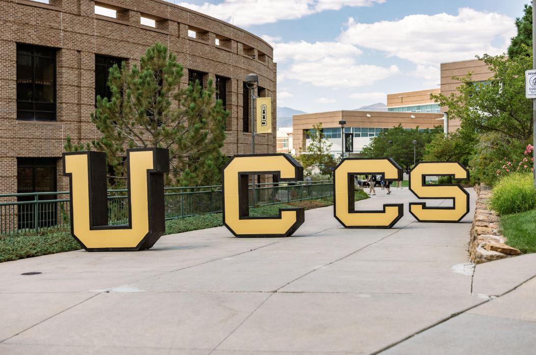 Photo of UCCS block letters on sidewalk