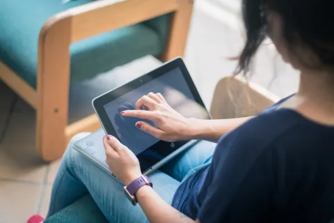 student working on their tablet