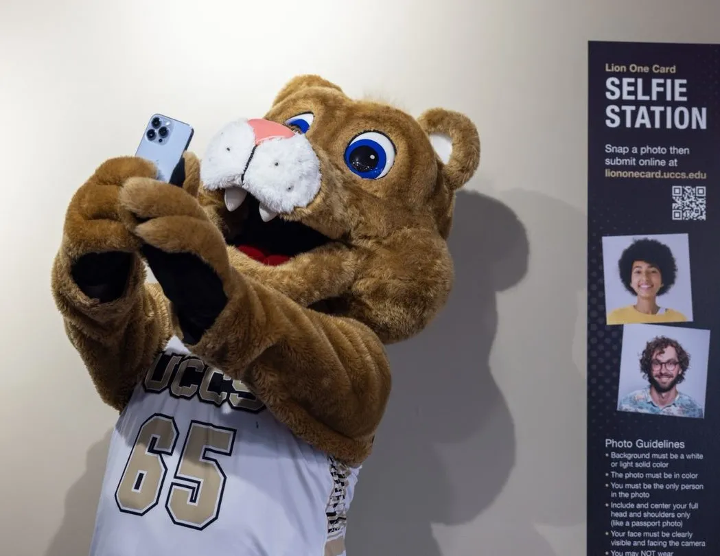 UCCS Mascot Clyde taking a selfie for an ID.