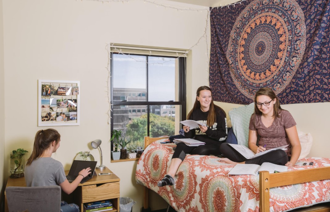 Students siting in a residence hall room